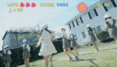 a group of girls are dancing in front of a building that says life score and 30
