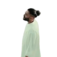 a man with a ponytail and beard wearing a white shirt