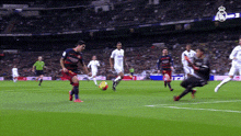 a soccer game is being played in a stadium with a logo for real madrid