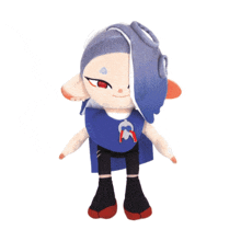 the back of a stuffed animal with a blue dress and red shoes