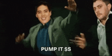 a man in a green sweater is smiling and saying `` pump it $ s '' .