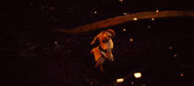 a man is standing in the dark looking up