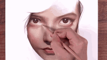 a close up of a person drawing a woman 's face