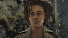 a man with dreadlocks looks at the camera