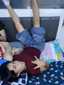 a person laying on a bed with their legs up