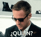 a man wearing sunglasses says " quien " in spanish