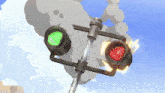a green light and a red light on a pole with smoke coming out of them