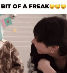 a picture of a person with the words bit of a freak below them