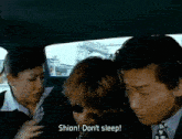 a group of people in a car with shion written on the screen