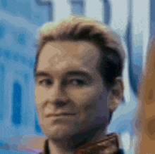 a close up of a man 's face with a blurry background