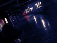 a blurry picture of a dark room with a sign that says t.