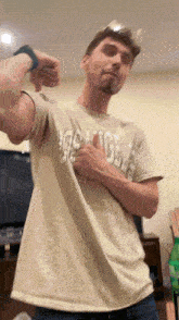 a man wearing a t-shirt that says ' abercrombie & fitch ' on it