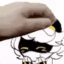 a hand is holding a cartoon character 's head .