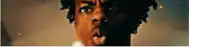 a close up of a man 's face with half of his face in the dark