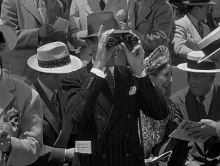 бинокль смотреть отвратительно костюм шляпа GIF - Binoculars Race Track You Were Never Lovelier GIFs
