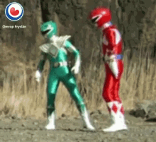 a green power ranger and a red power ranger standing next to each other