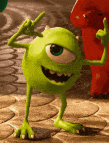mike wazowski from monsters inc is giving a peace sign
