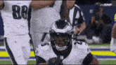 a football player wearing a helmet with the number 88 on the back