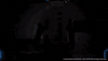 a silhouette of a person standing in front of a light with the year 2002 on the bottom right