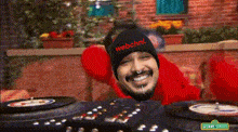 a man wearing a black beanie with webchnl written on it