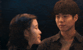 a close up of a woman 's face with a man kissing her