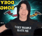 a man is wearing a black shirt that says ugly people hate me