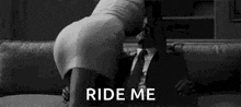 a woman is kneeling on a man 's lap on a couch and asking him to ride her .