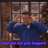 a man is standing in front of a christmas tree and saying that did not just happen .