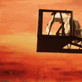 a woman in a white dress is hanging from chains in a box
