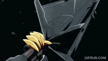 a gif of a robot being destroyed by another robot with the website gifrul.com in the corner