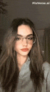 a woman wearing glasses and a denim shirt with pixverse.ai written on the bottom