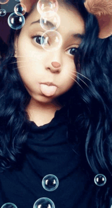 a girl wearing a cat mask with bubbles around her face