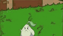 a cartoon character is standing in the grass with a green tail .
