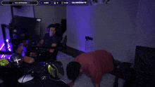 a man is doing push ups in front of a jbl quantum monitor