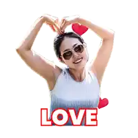 a woman is making a heart shape with her hands and the word love is below her