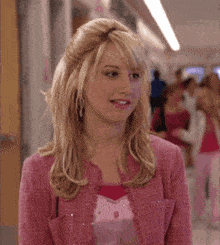 a woman in a pink jacket is standing in a hallway with the words " villain " written on the bottom