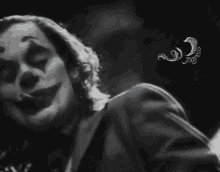 a black and white photo of a clown with a watermark that says ' imagination ' on it