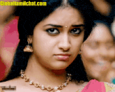 a close up of a woman 's face with the website globaltamilchat.com visible in the corner