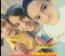 a boy and two girls are posing for a picture with the words " işte böyle arkadaşlardir " in the corner