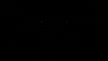 a virtual reality headset and two xbox controllers on a dark background