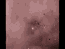 a close up of a red background with a few dots on it