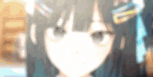 a close up of a girl 's face with a blurry background .
