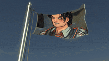 a flag with a picture of a man flying in the wind