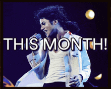 a man singing into a microphone with the words this month