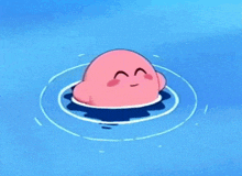 a pink cartoon character is floating on top of a blue body of water .