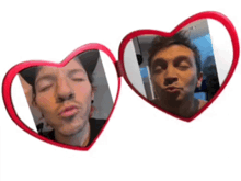 two heart shaped mirrors with a man making a face