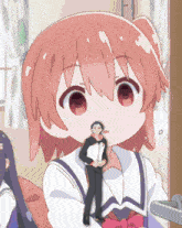 a cartoon girl with pink hair is holding a small figurine of a man on a string