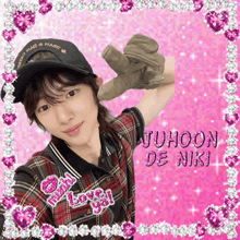 a girl wearing a plaid shirt and a hat with the name juhoon de niki