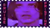a close up of a person 's face in a purple frame with the word pristine on the bottom .