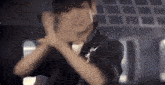 a man in a black jacket with a star on his chest is dancing